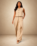 SILKANDLUXE beige wide-leg pants with wrap skirt overlay and contrast stitching. Model wears beige sleeveless top.