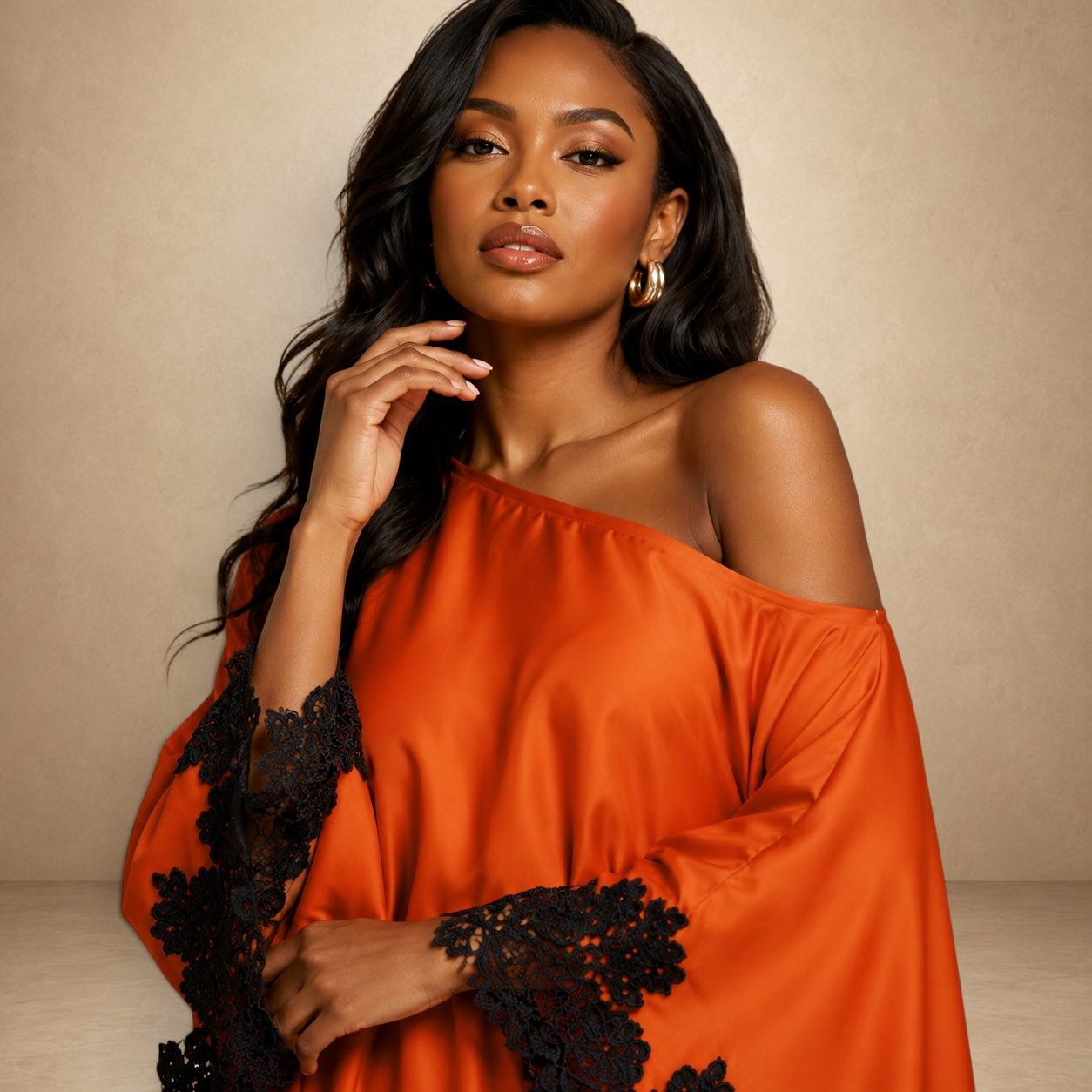 SILKANDLUXE vibrant orange off-the-shoulder kaftan maxi dress with black lace trim on sleeves and hem.