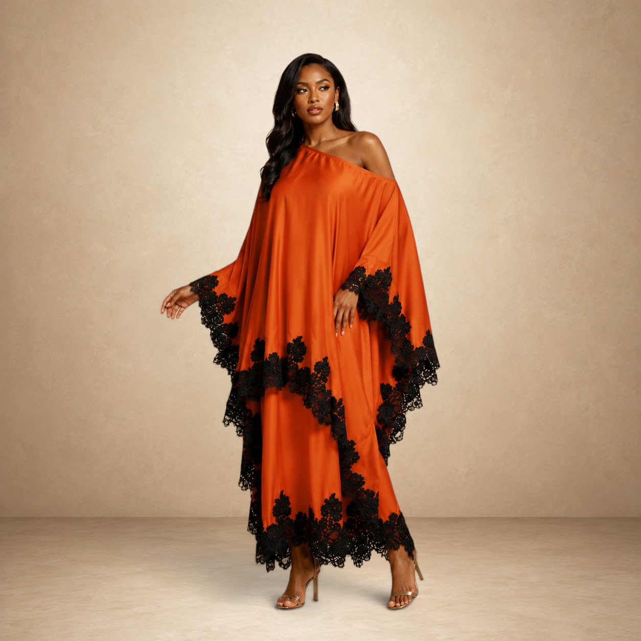 SILKANDLUXE vibrant orange flowing kaftan maxi dress with black lace trim and off-the-shoulder neckline.